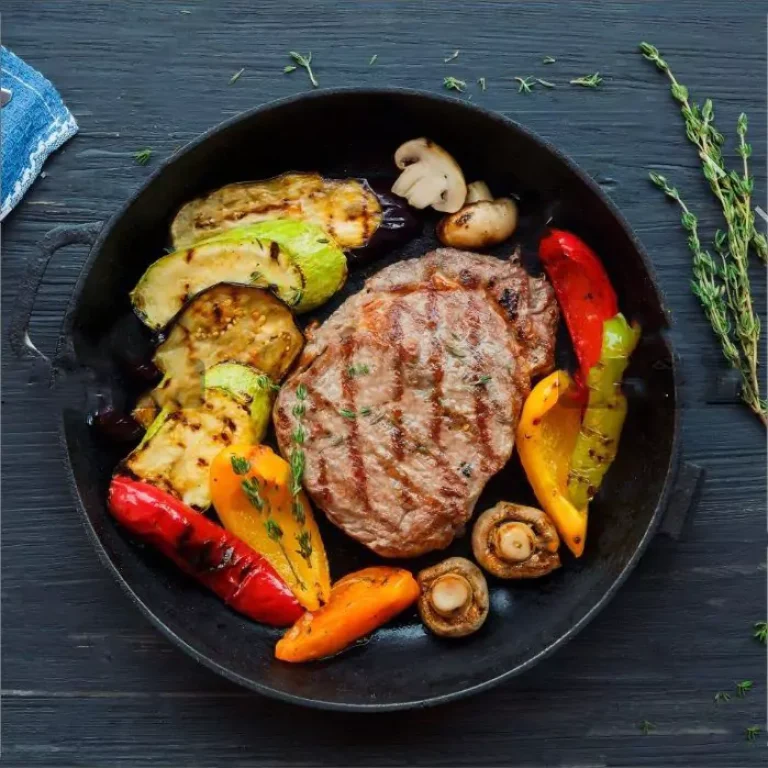 grilled-beef-steak-on-dark-wooden-table-p4nlm25-658a8cdb573f2